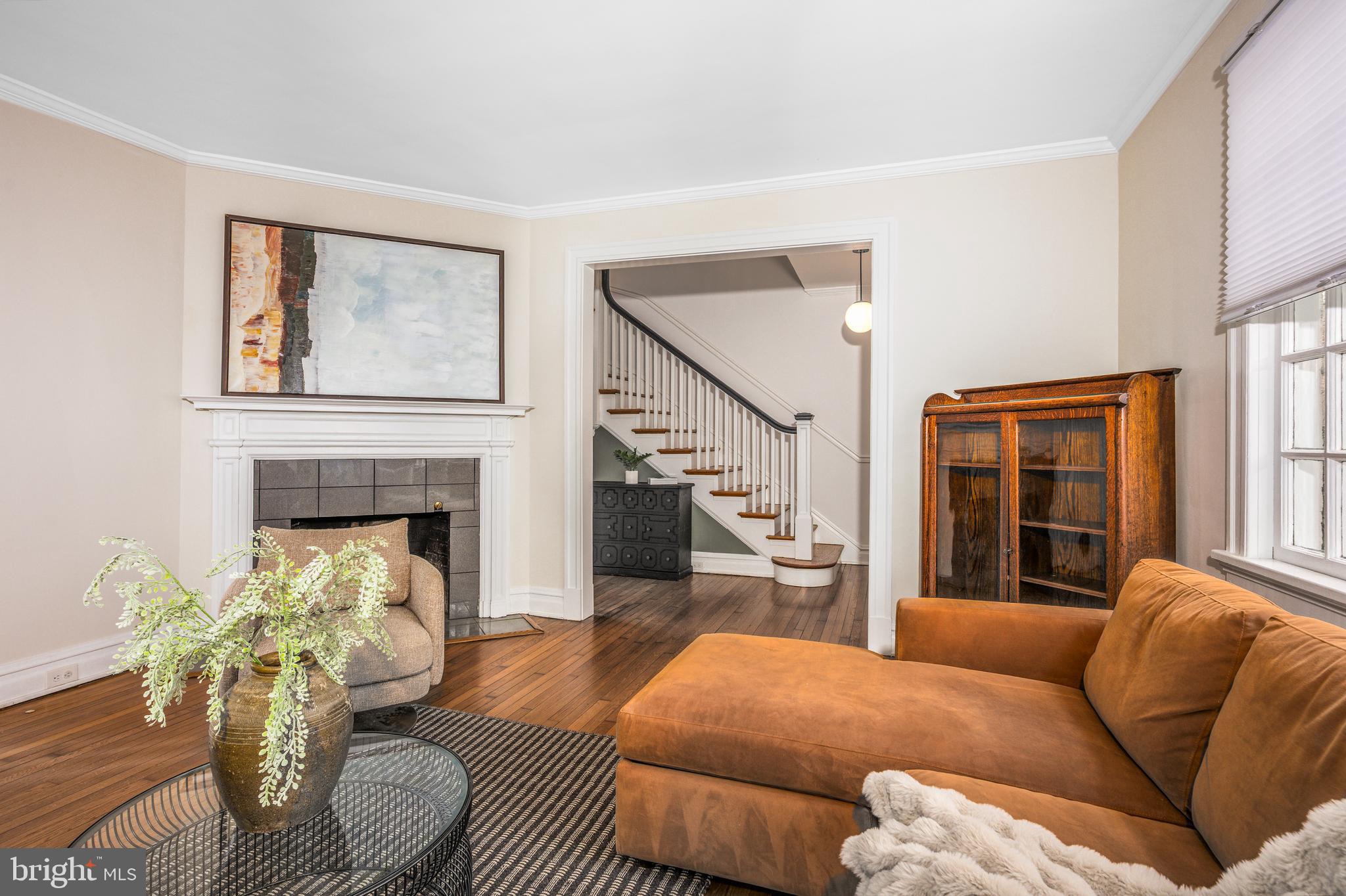 4307 Wickford Road Baltimore, MD 21210 - Photo 6 of 38 a living room with furniture and a fireplace