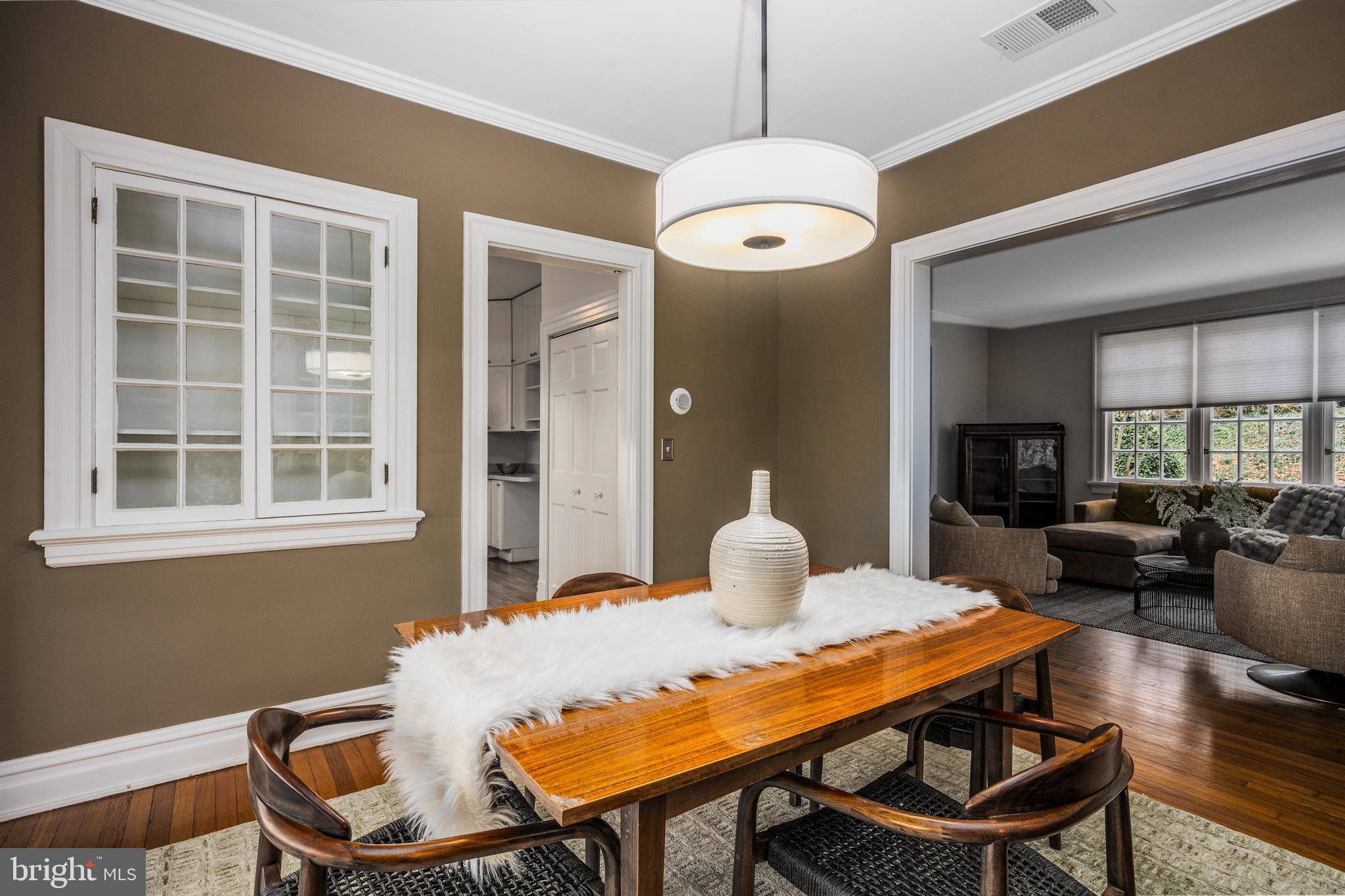 4307 Wickford Road Baltimore, MD 21210 - Photo 8 of 38 a view of a dining room with furniture window and wooden floor