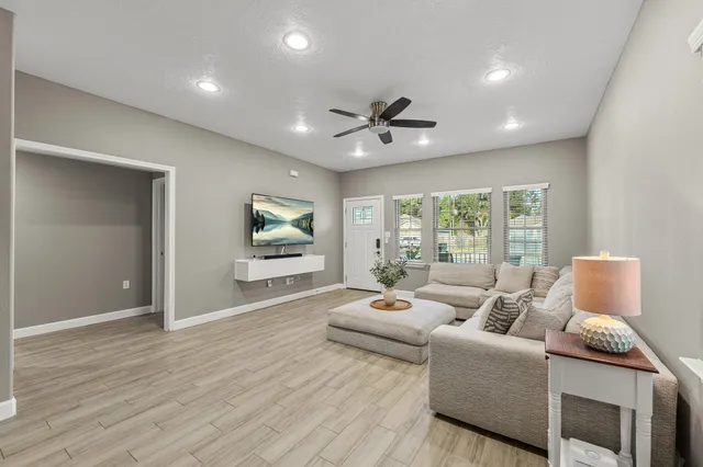 a living room with furniture and a large window