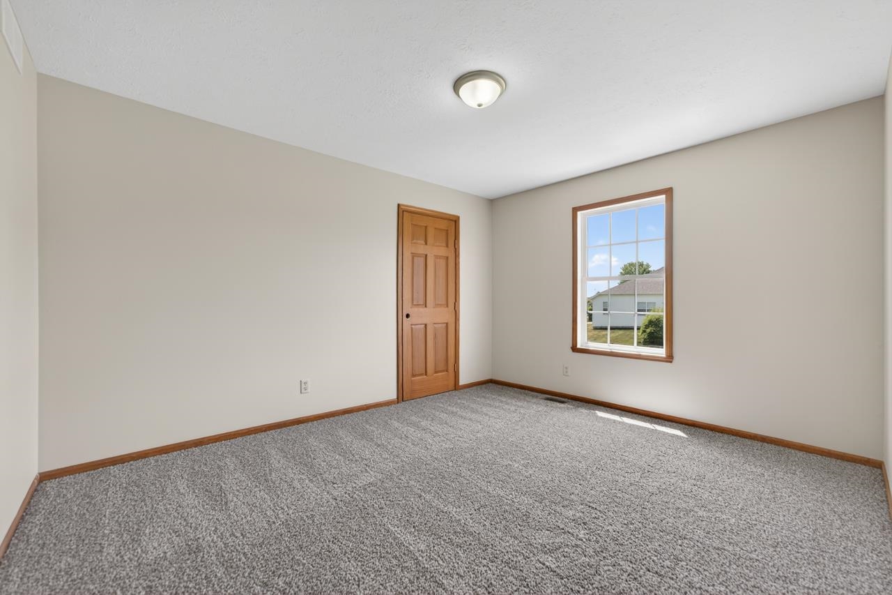 676 Elberon Way Roscoe, IL 61073 - Photo 23 of 30 an empty room with windows