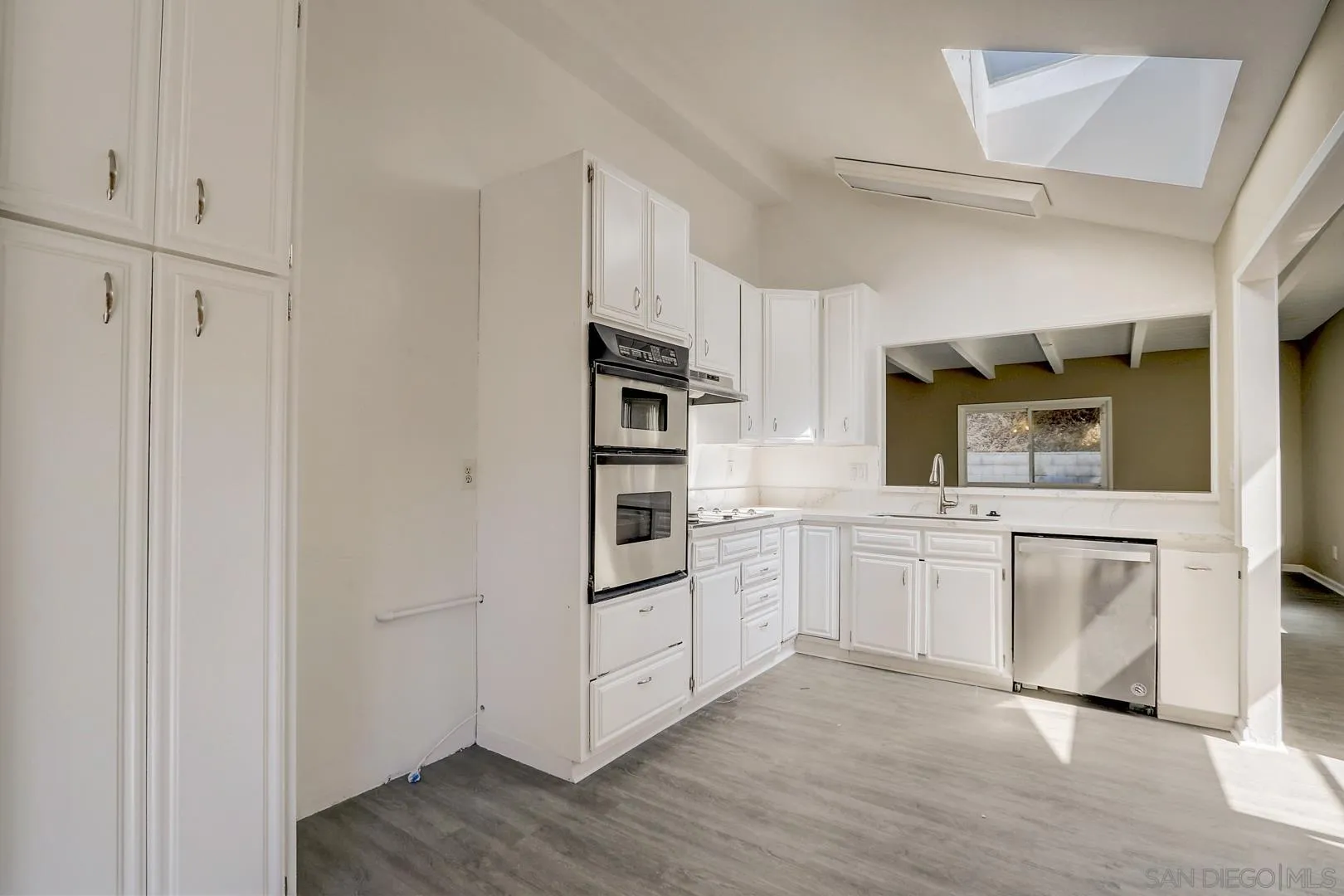 15107 Hesta Street Poway, CA 92064 - Photo 15 of 23 a kitchen with stainless steel appliances a refrigerator and a stove top oven