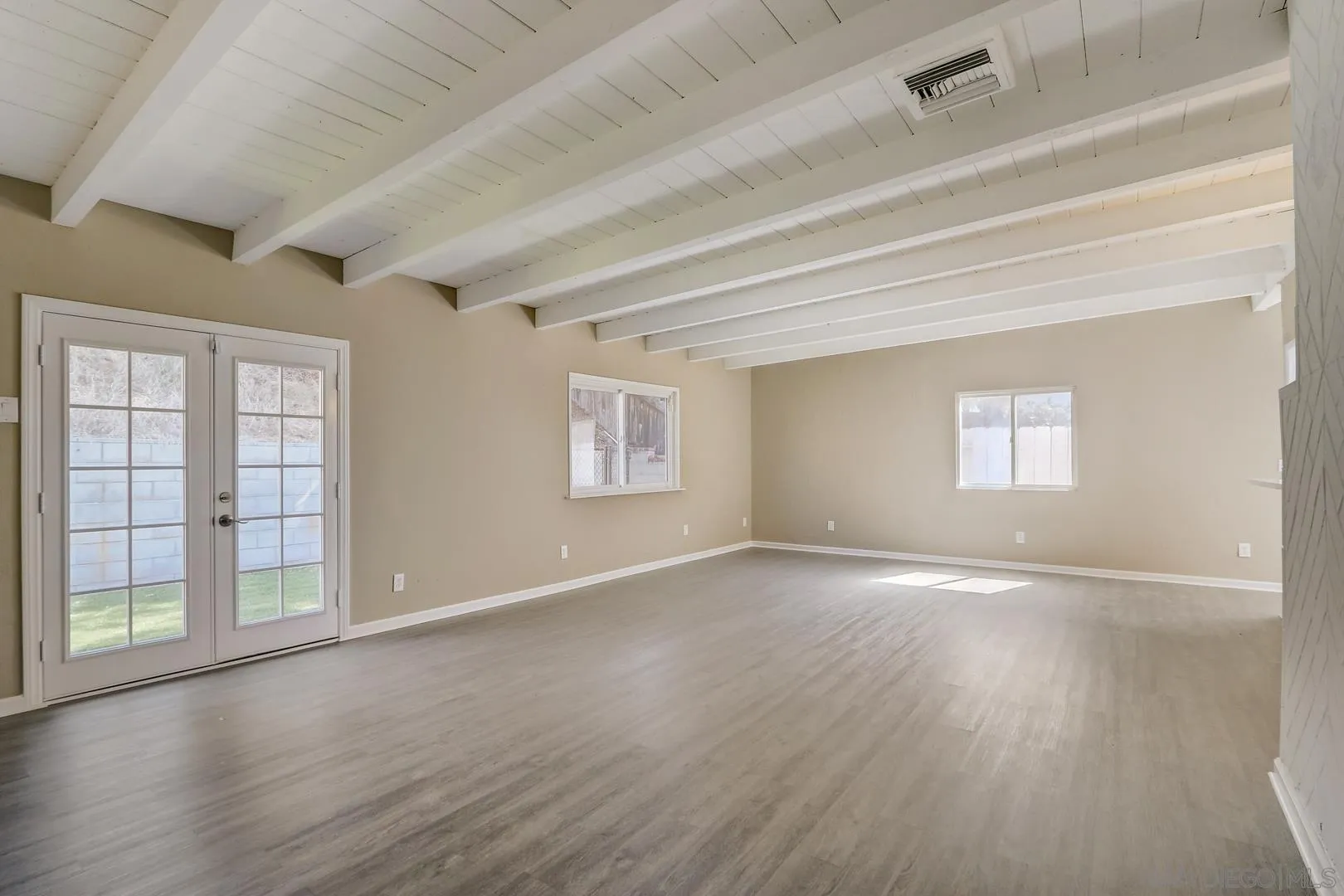 15107 Hesta Street Poway, CA 92064 - Photo 19 of 23 a view of an empty room with wooden floor and a window