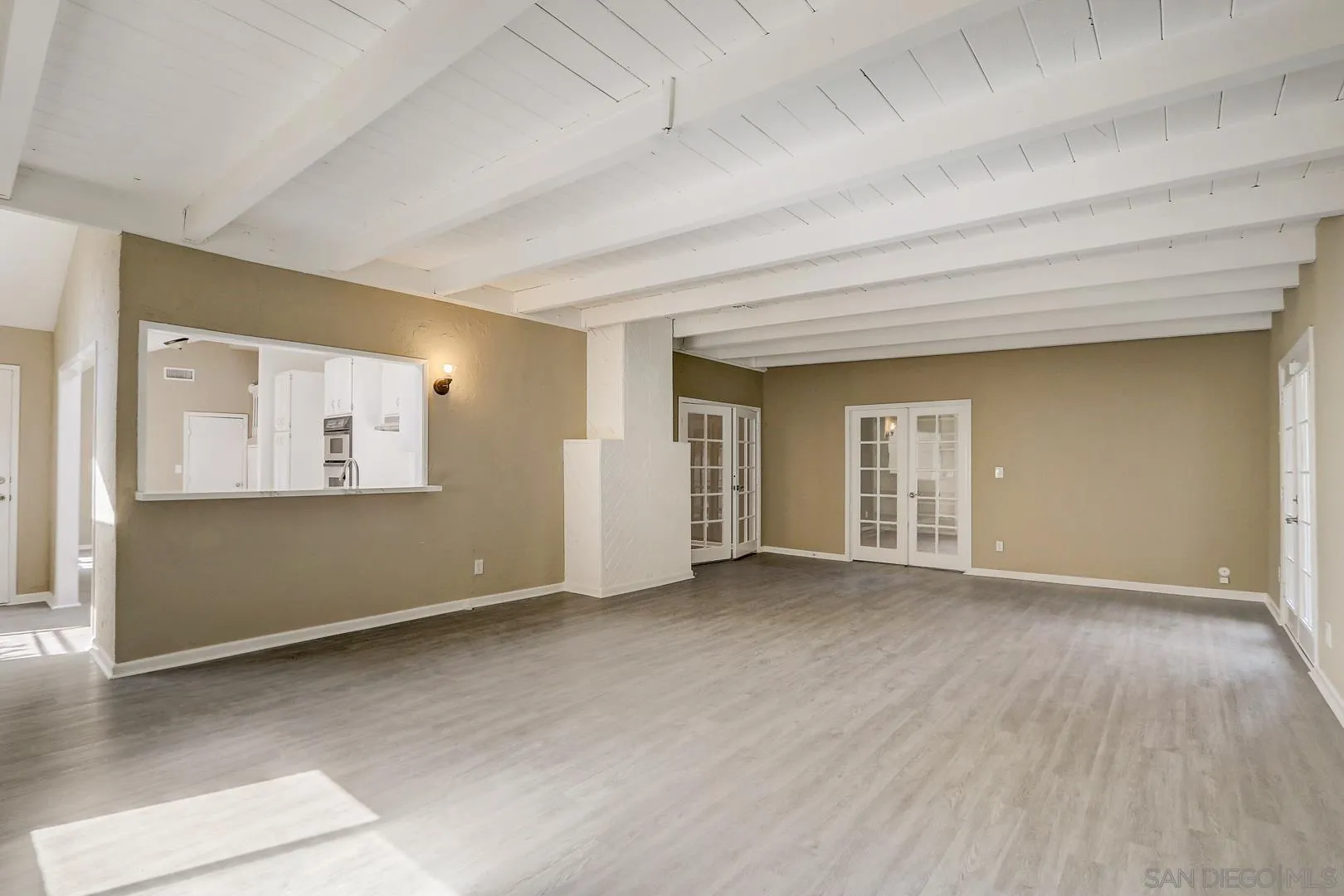 15107 Hesta Street Poway, CA 92064 - Photo 5 of 23 a view of an empty room with window and wooden floor