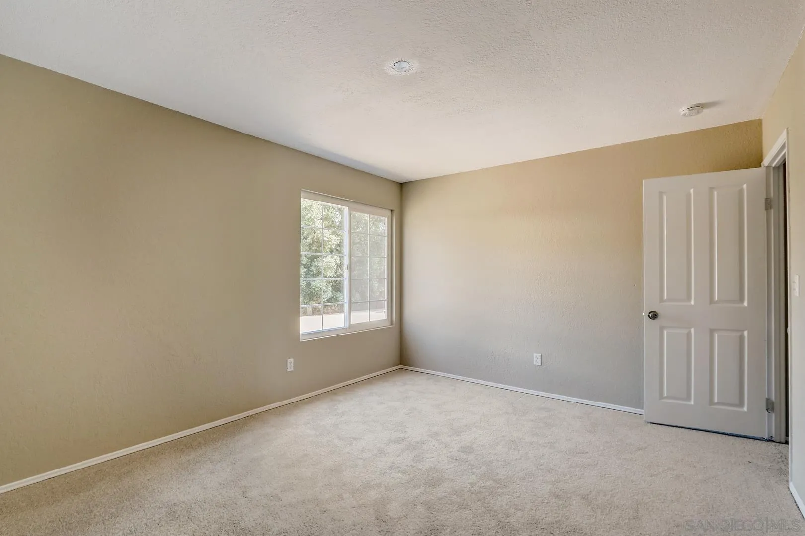 15107 Hesta Street Poway, CA 92064 - Photo 7 of 23 a view of an empty room with a window