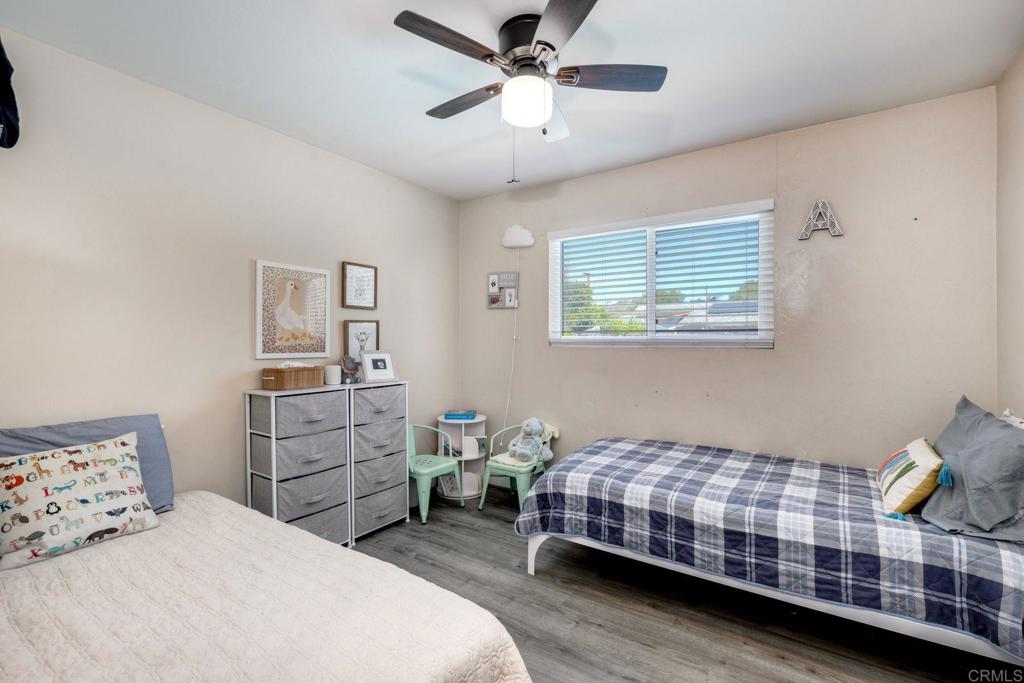 924 Daisy Street Escondido, CA 92027 - Photo 11 of 25 a bedroom with a bed and window
