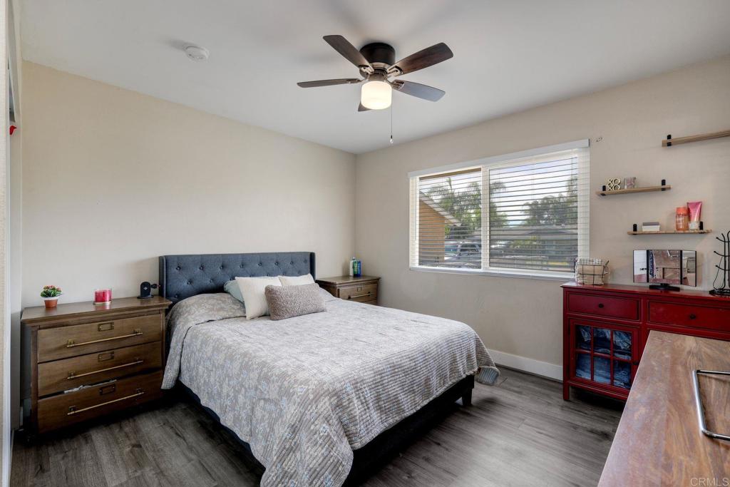 924 Daisy Street Escondido, CA 92027 - Photo 18 of 25 a bedroom with a bed and a window