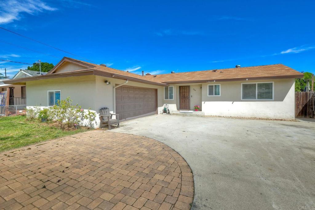 924 Daisy Street Escondido, CA 92027 - Photo 22 of 25 a front view of a house with a yard