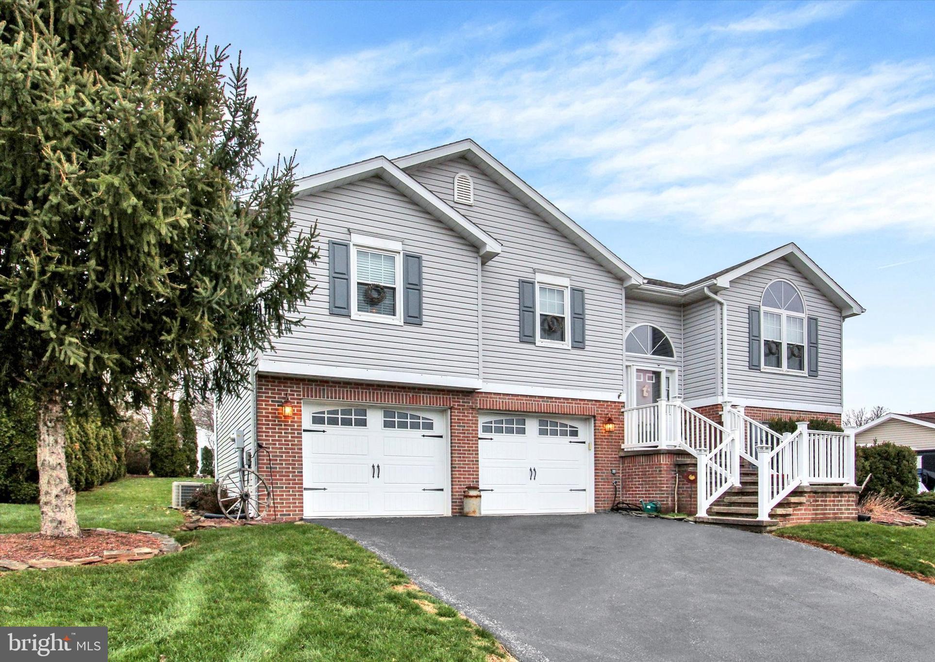 2790 Butternut Lane York, PA 17408 - Photo 2 of 30 a view of a house with a yard and garage