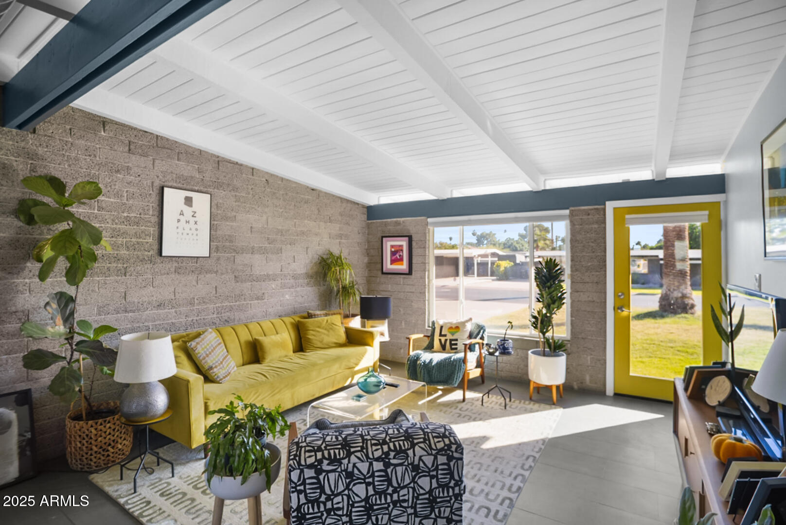 1504 East Rancho Drive Phoenix, AZ 85014 - Photo 2 of 10 a living room with furniture and a large window