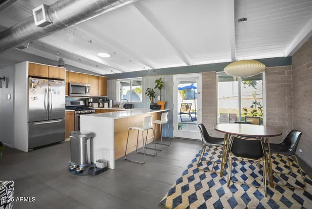 a kitchen with counter space cabinets and appliances