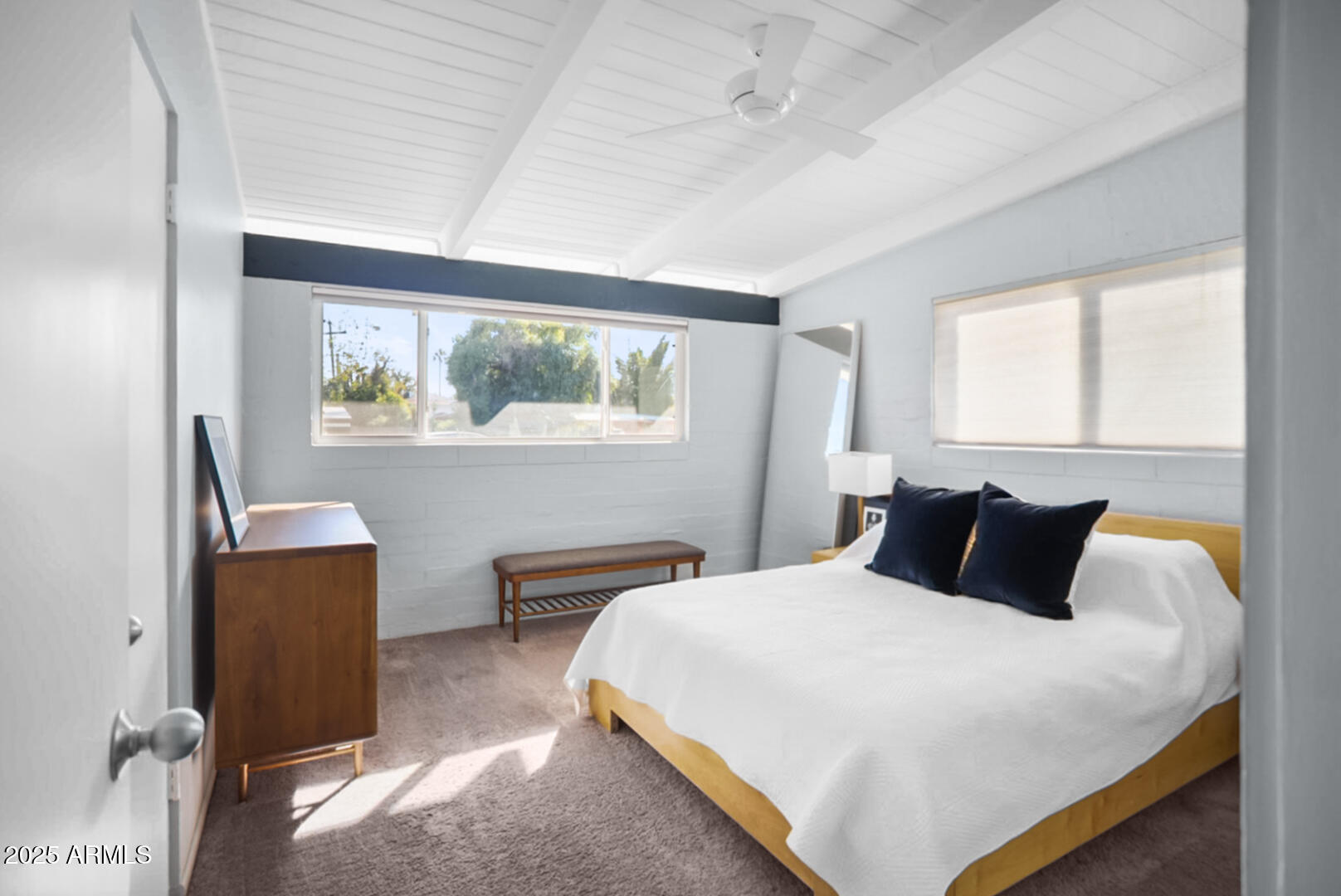 1504 East Rancho Drive Phoenix, AZ 85014 - Photo 5 of 10 a bedroom with a large bed and a large window