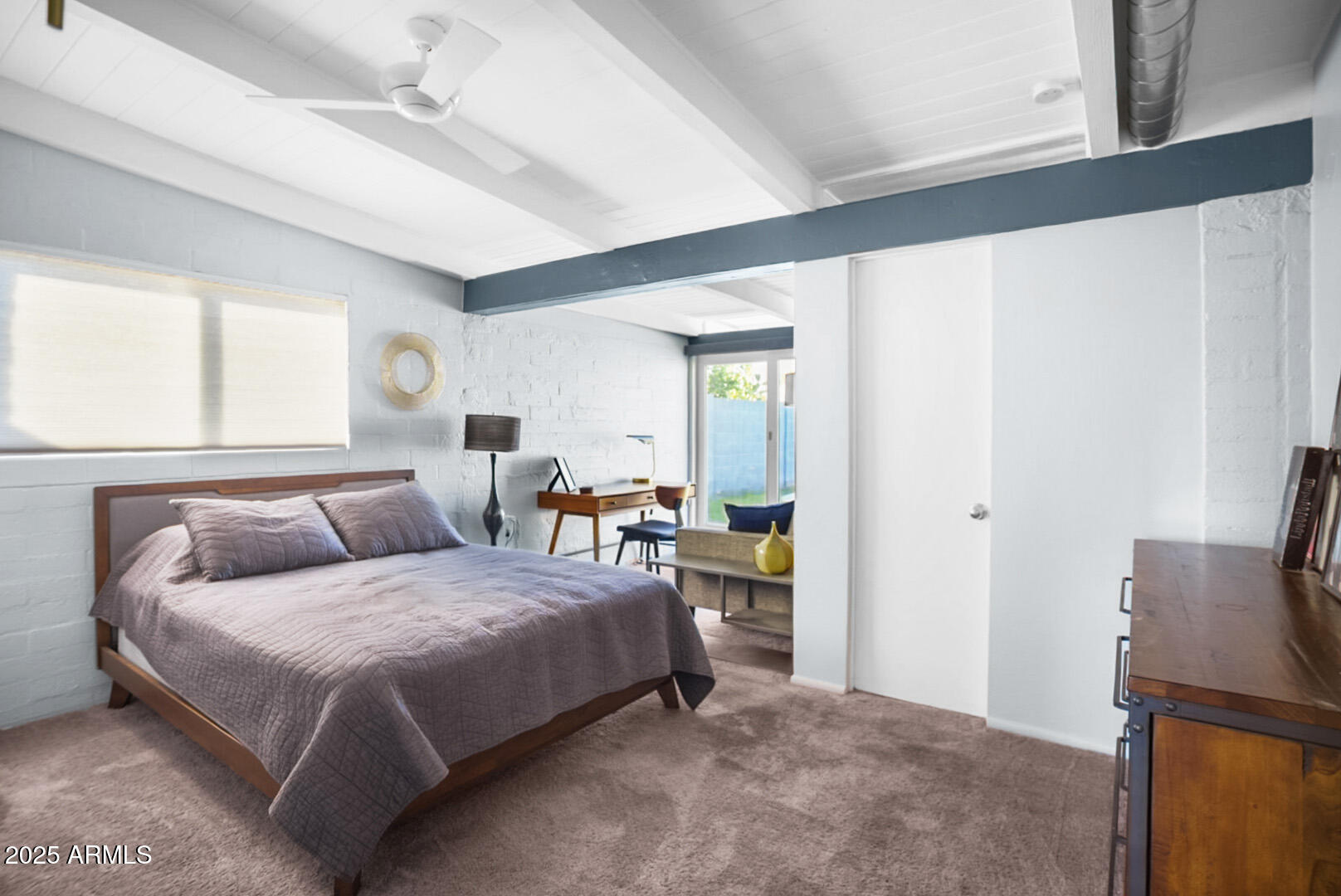 1504 East Rancho Drive Phoenix, AZ 85014 - Photo 6 of 10 a bedroom with a bed and large windows