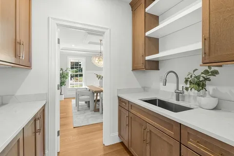 a kitchen with sink and view