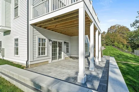a front view of a house with a yard outdoor seating and barbeque oven