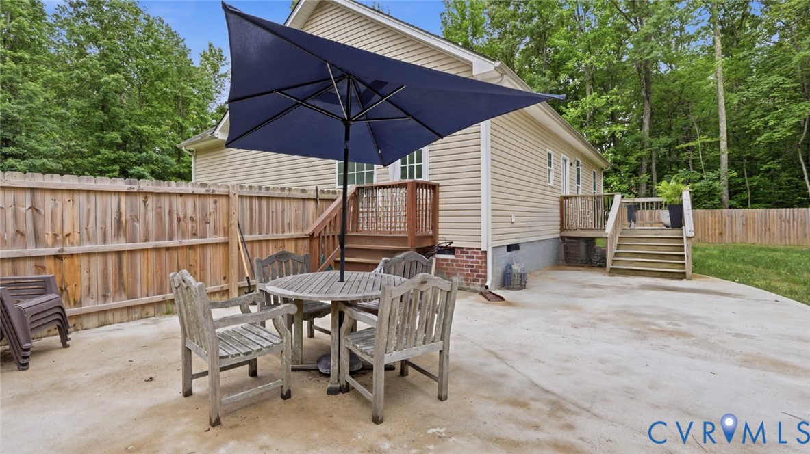 2406 Emanuel Church Road Powhatan, VA 23139 - Photo 47 of 48 Expansive concrete patio with a full wooden privac