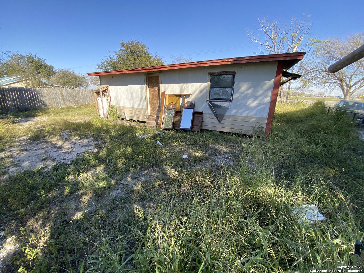 509 Highway 359 Mathis, TX 78368 - Photo 4 of 10 a front view of a house with a yard
