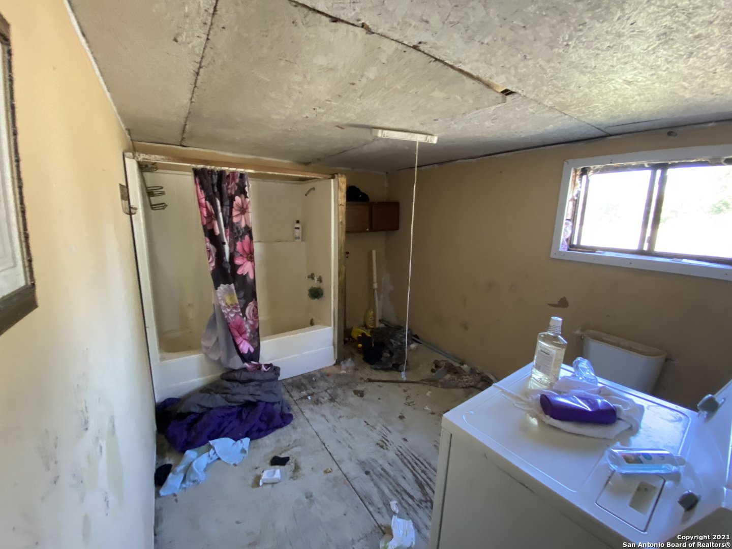 509 Highway 359 Mathis, TX 78368 - Photo 8 of 10 a bathroom with a sink and a mirror