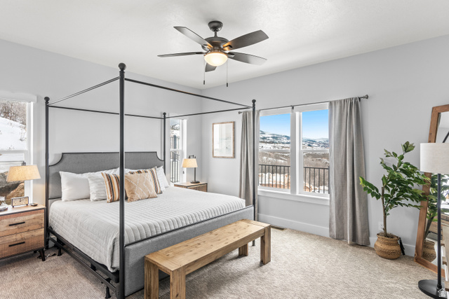 1343 North Trapper Loop Garden City, UT 84028 - Photo 16 of 56 Bedroom featuring light colored carpet and a ceiling fan