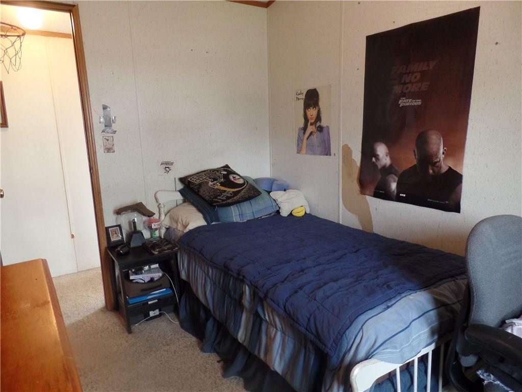 322 Cypress Avenue Rochester, PA 15074 - Photo 12 of 15 a bedroom with a bed and wall painting