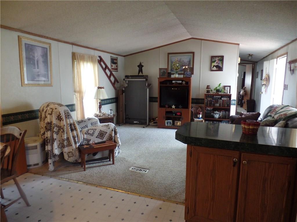 322 Cypress Avenue Rochester, PA 15074 - Photo 7 of 15 a living room with furniture a window and gym equipment