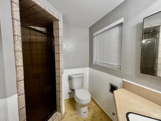 a view of a backyard with a tree