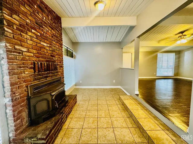 a kitchen with a stove and a white cabinets