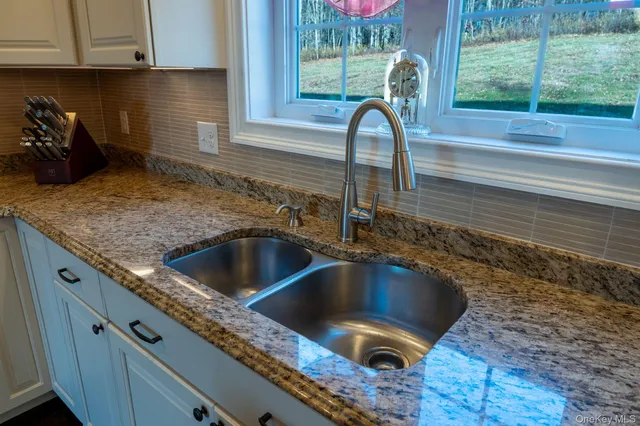 a stove top oven sitting inside of a kitchen