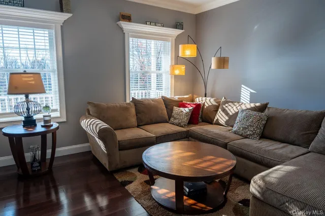 a kitchen with stainless steel appliances granite countertop a sink dishwasher and cabinets with wooden floor