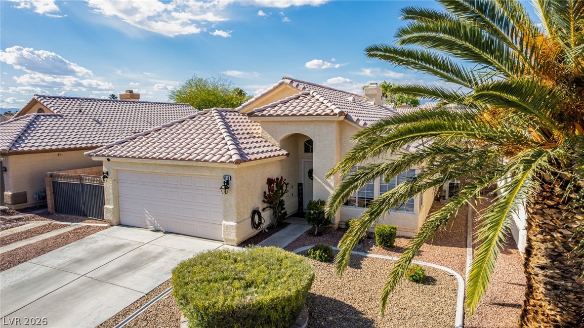 5112 West Camino Del Rancho Las Vegas, NV 89130 - Photo 34 of 44 This charming residence features a well-maintained exterior and a welcoming facade, perfect for comfortable living.