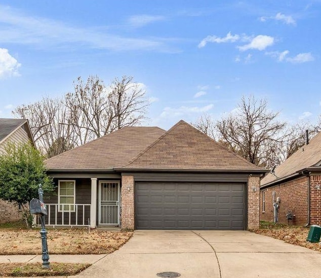5616 Falling Bark Drive Memphis, TN 38134 - Photo 3 of 15 a front view of a house with a garage