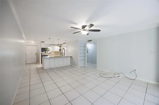 a view of a kitchen with cabinets and stainless steel appliances