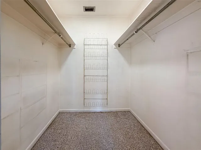 an aerial view of house with yard and mountain view in back