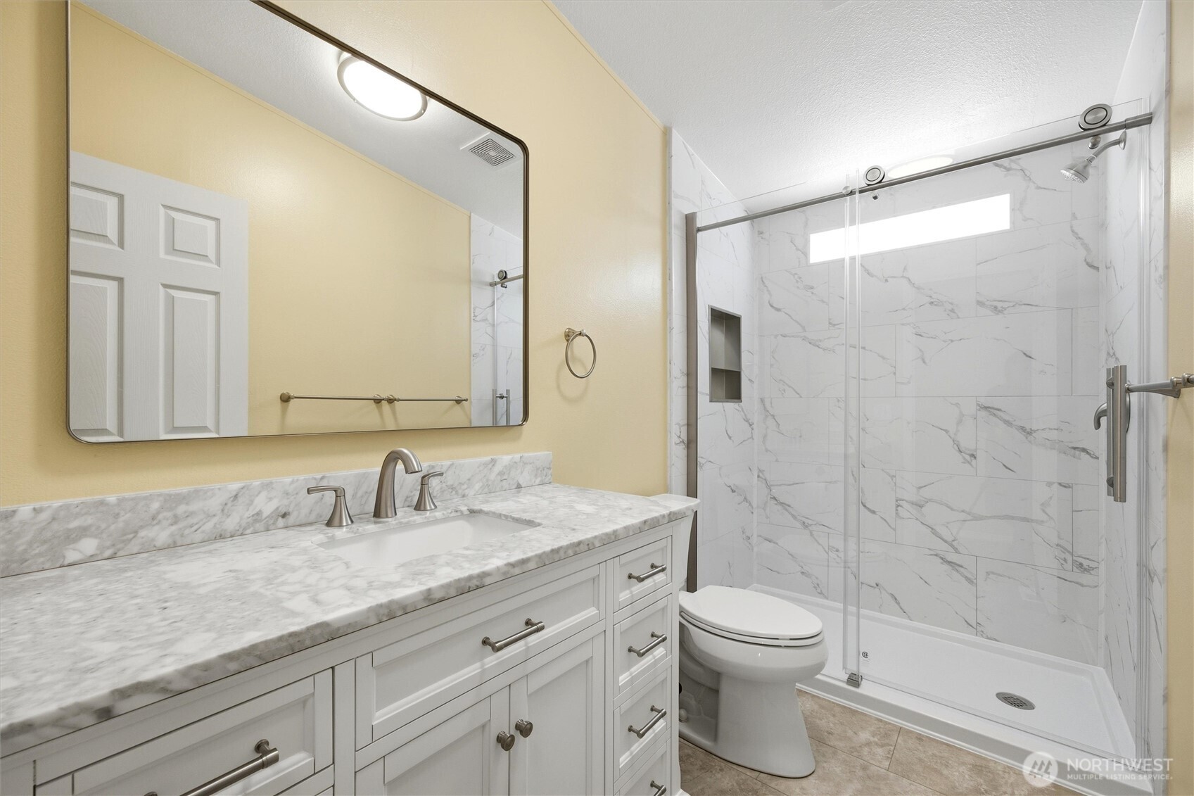 49 Ridgecliff Drive Richland, WA 99352 - Photo 11 of 29 a bathroom with a granite countertop sink a toilet and shower