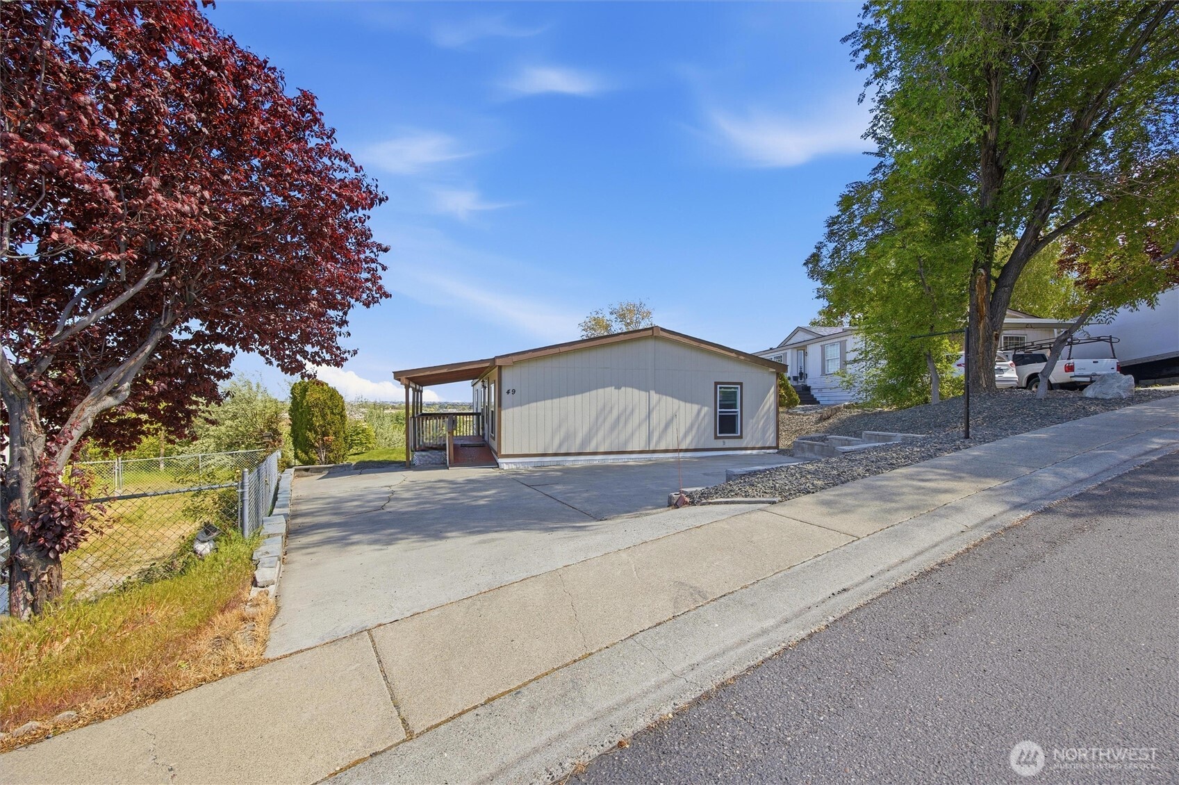 49 Ridgecliff Drive Richland, WA 99352 - Photo 28 of 29 a tall house with trees in front of it