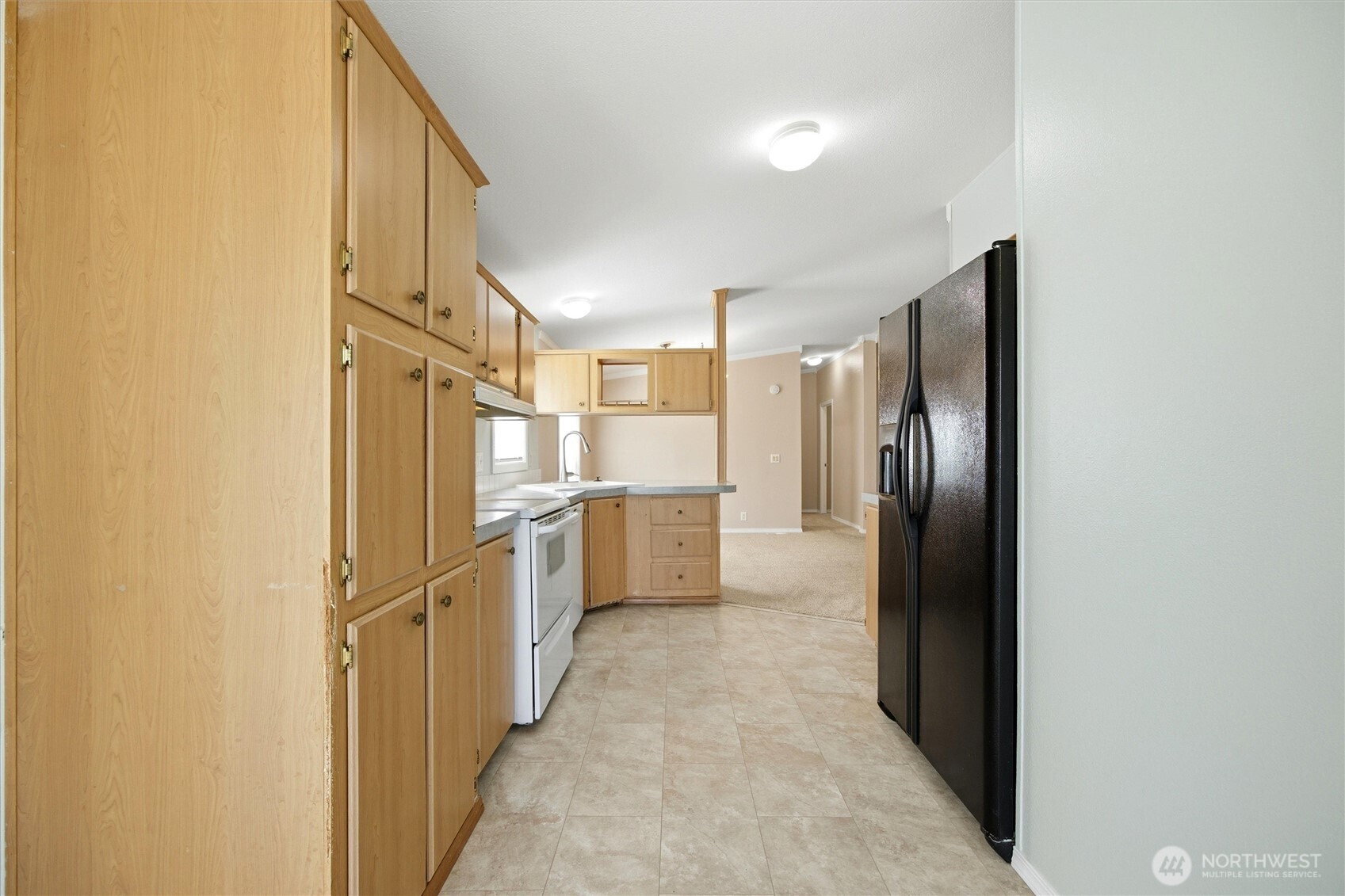 49 Ridgecliff Drive Richland, WA 99352 - Photo 9 of 29 a view of a kitchen with a refrigerator