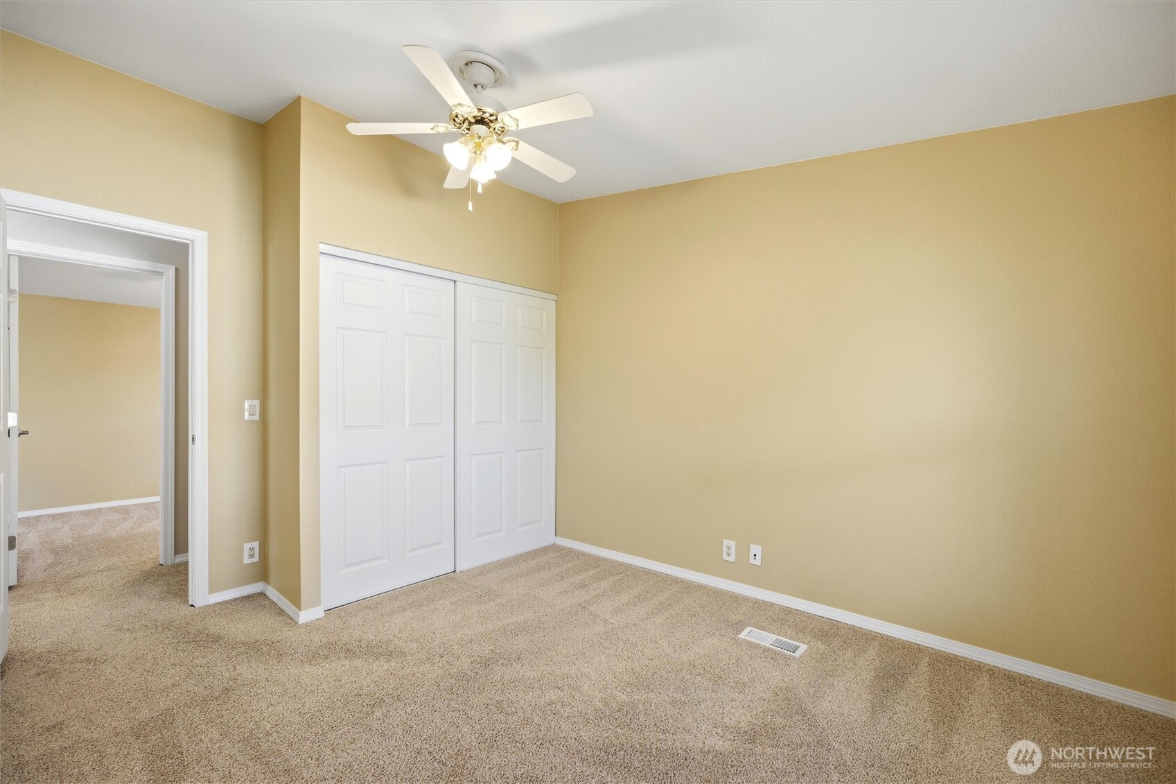 49 Ridgecliff Drive Richland, WA 99352 - Photo 10 of 29 an empty room with a chandelier fan and a chandelier fan