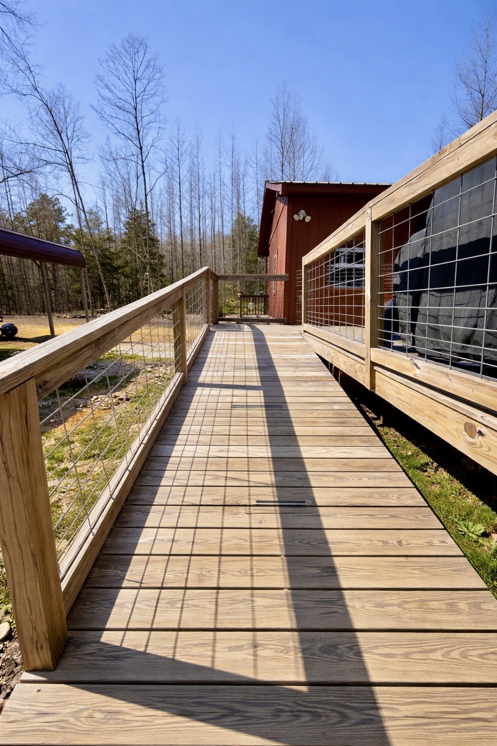 664 Russ Valley Road Lobelville, TN 37097 - Photo 12 of 63 a view of balcony with wooden floor and fence