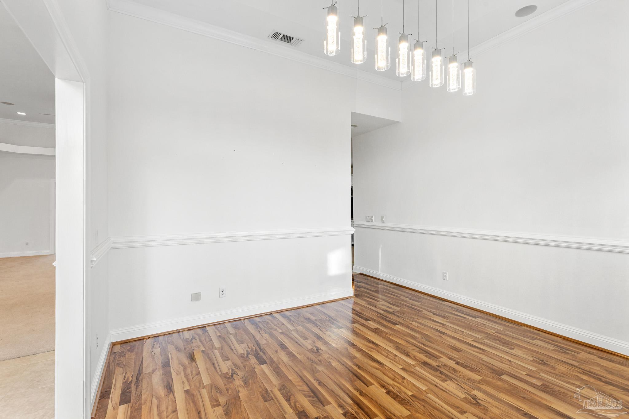 6786 Quintette Road Pace, FL 32571 - Photo 13 of 60 a view of a room with wooden floor