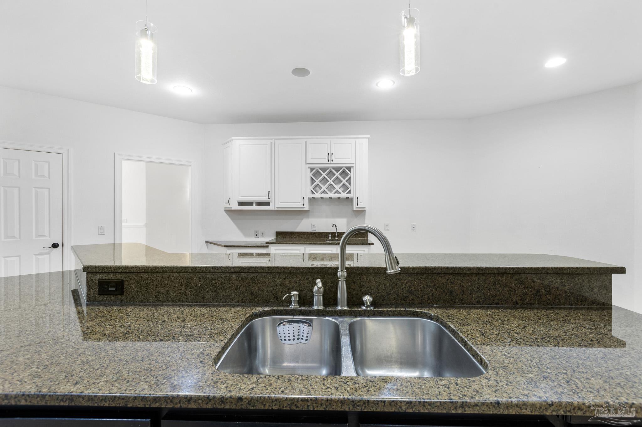 6786 Quintette Road Pace, FL 32571 - Photo 17 of 60 a close view of sink and tap