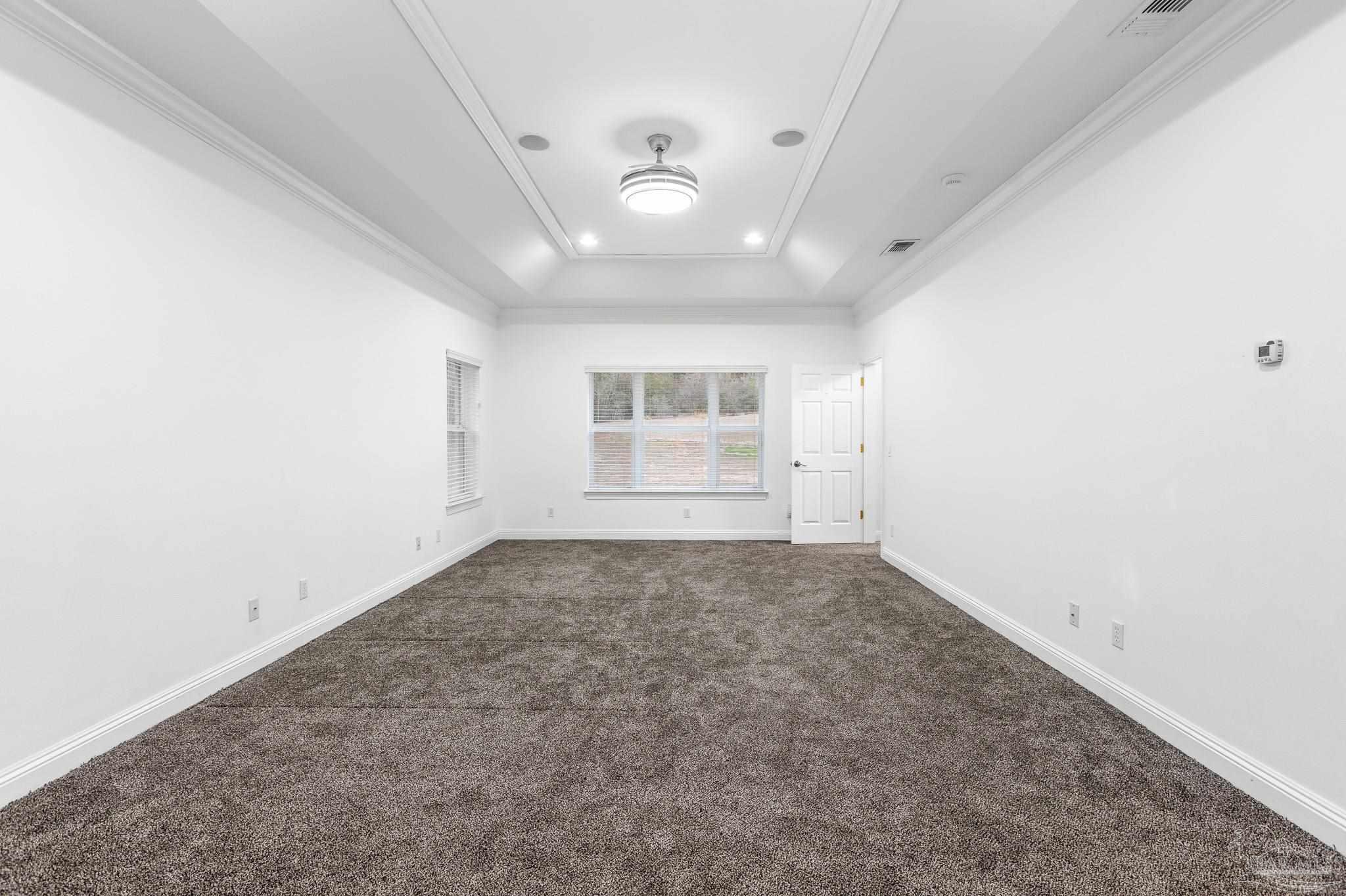 6786 Quintette Road Pace, FL 32571 - Photo 27 of 60 an empty room with a empty space and windows