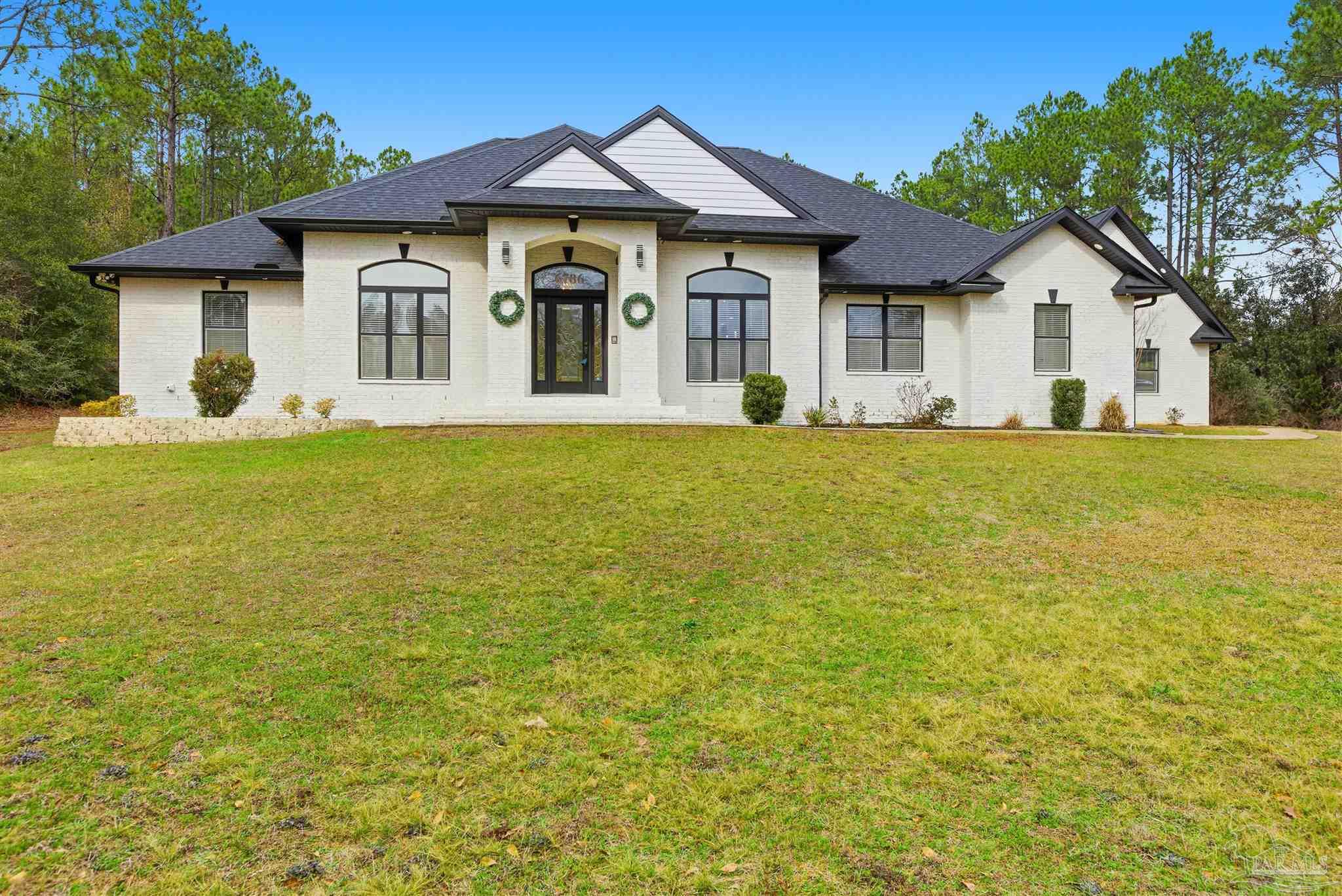 6786 Quintette Road Pace, FL 32571 - Photo 3 of 60 a view of a house with a yard