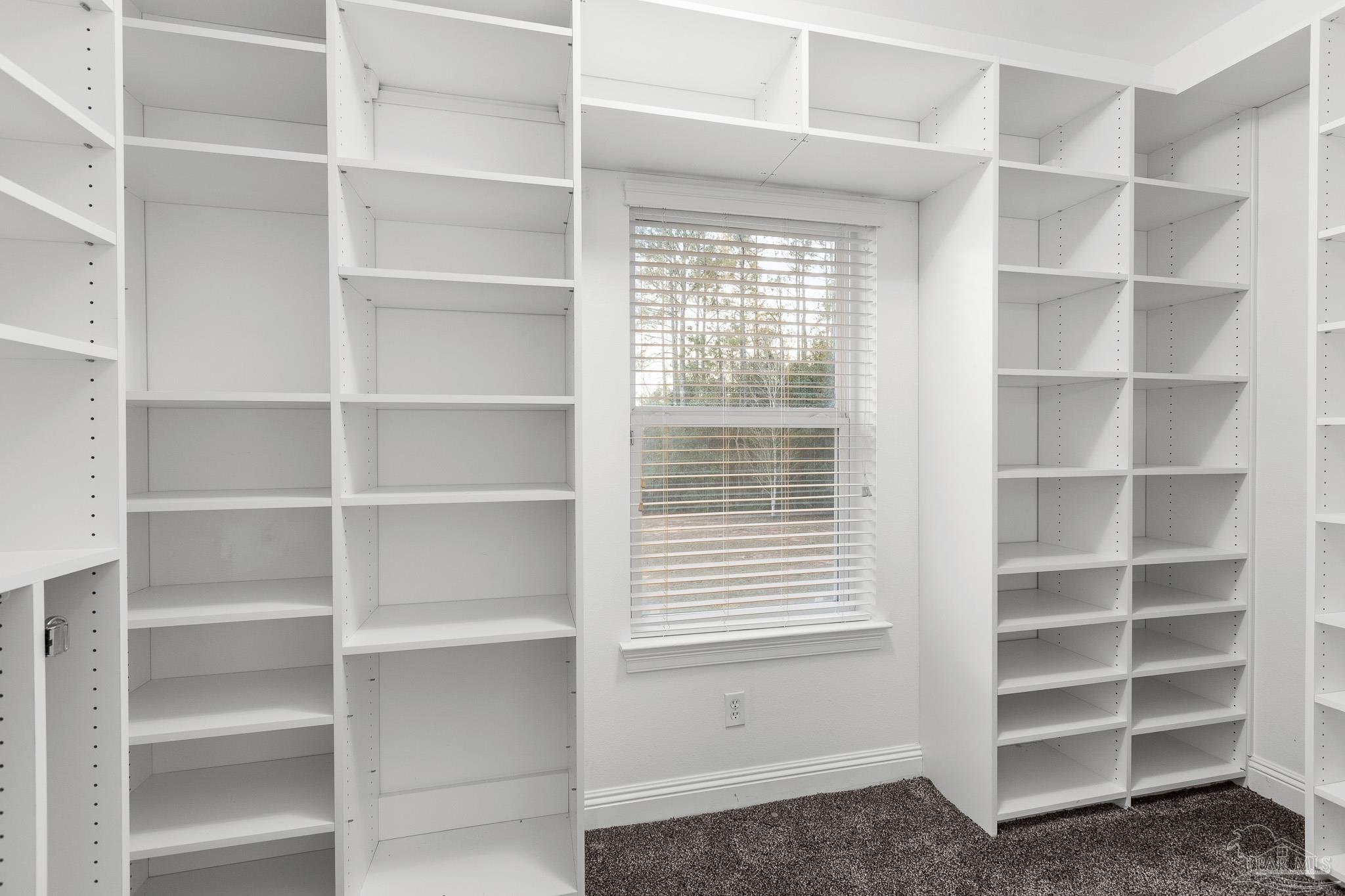 6786 Quintette Road Pace, FL 32571 - Photo 32 of 60 a view of a room with cabinets and window