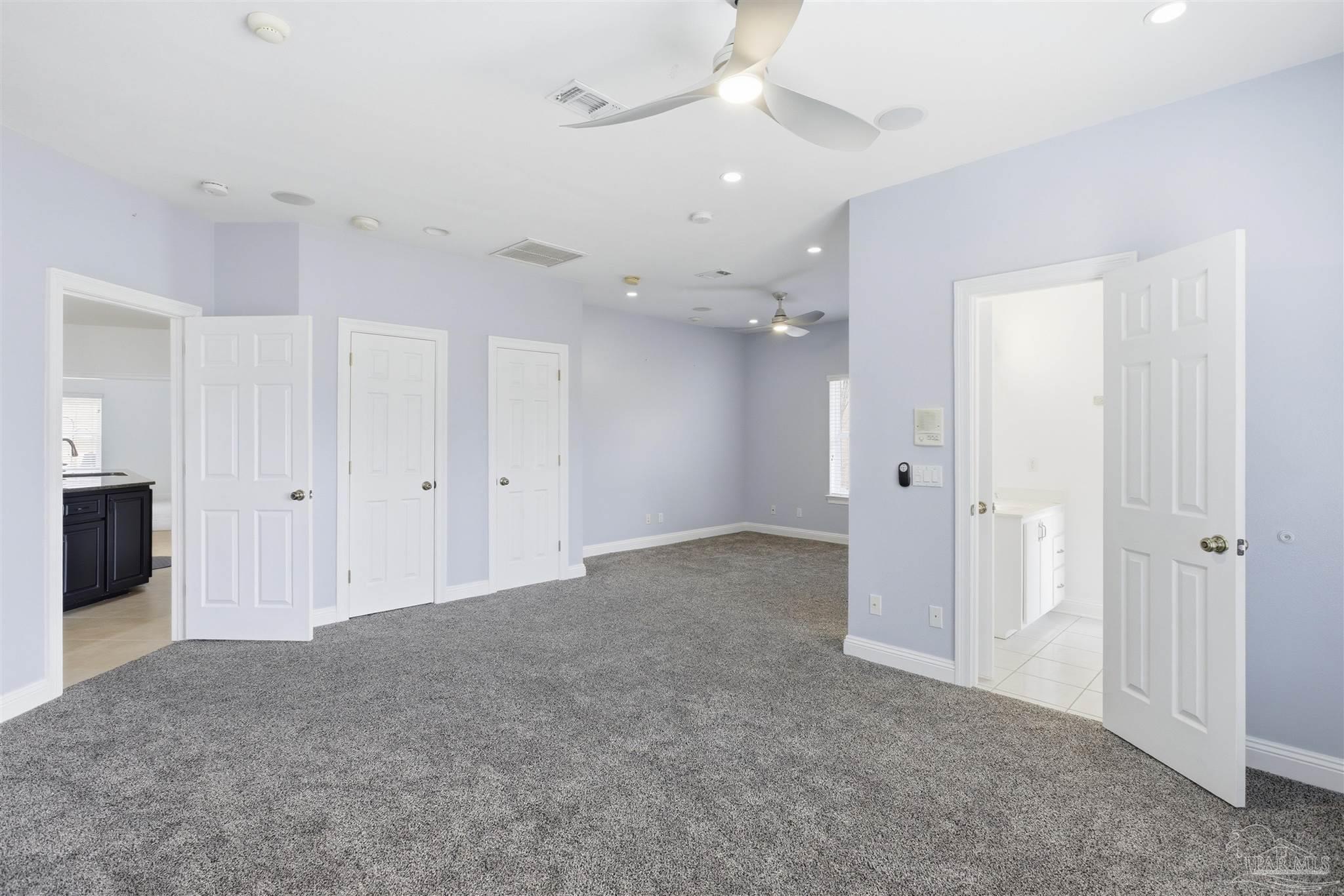 6786 Quintette Road Pace, FL 32571 - Photo 34 of 60 an empty room with fan and entrance