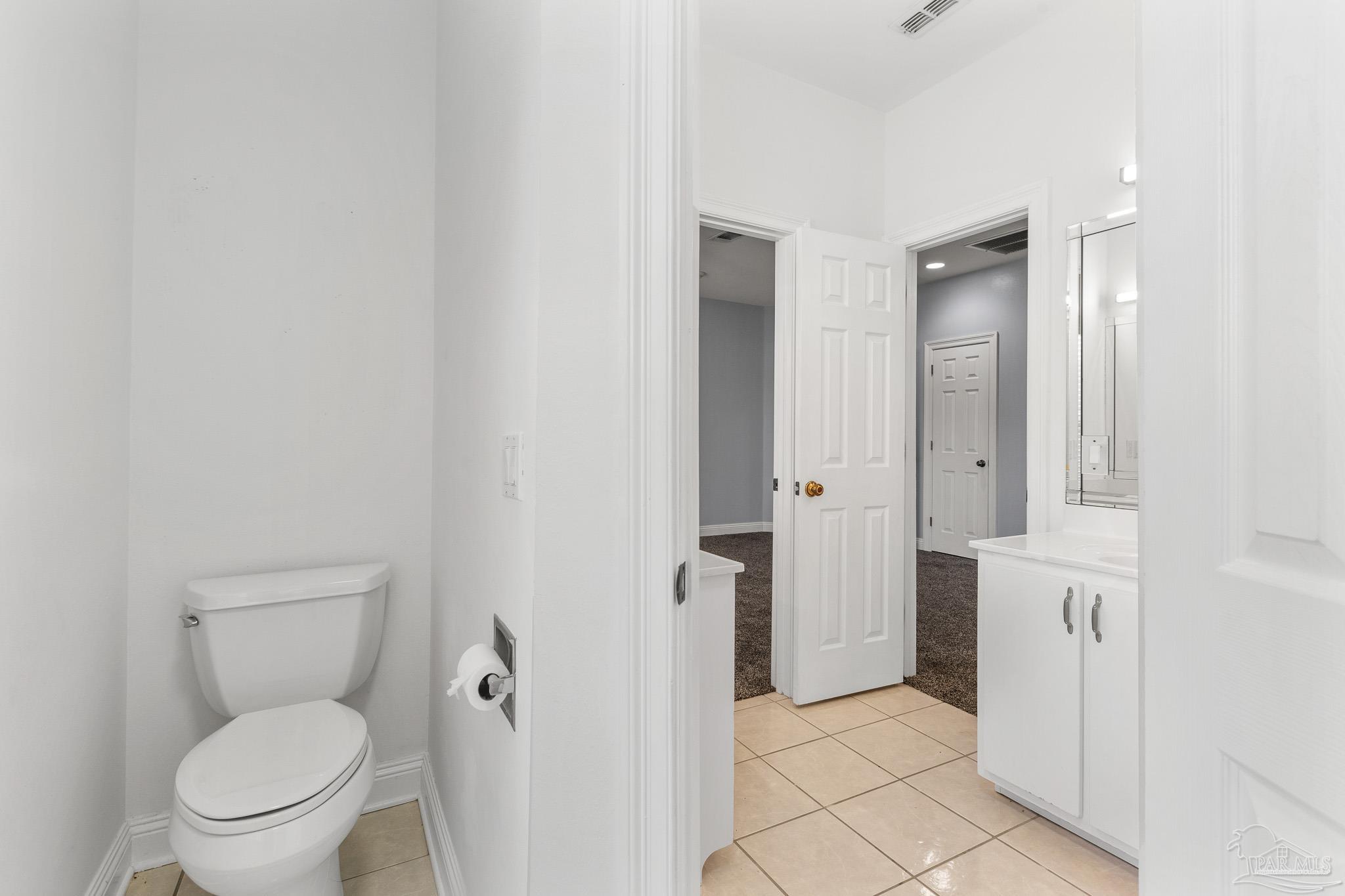 6786 Quintette Road Pace, FL 32571 - Photo 39 of 60 a bathroom with a toilet