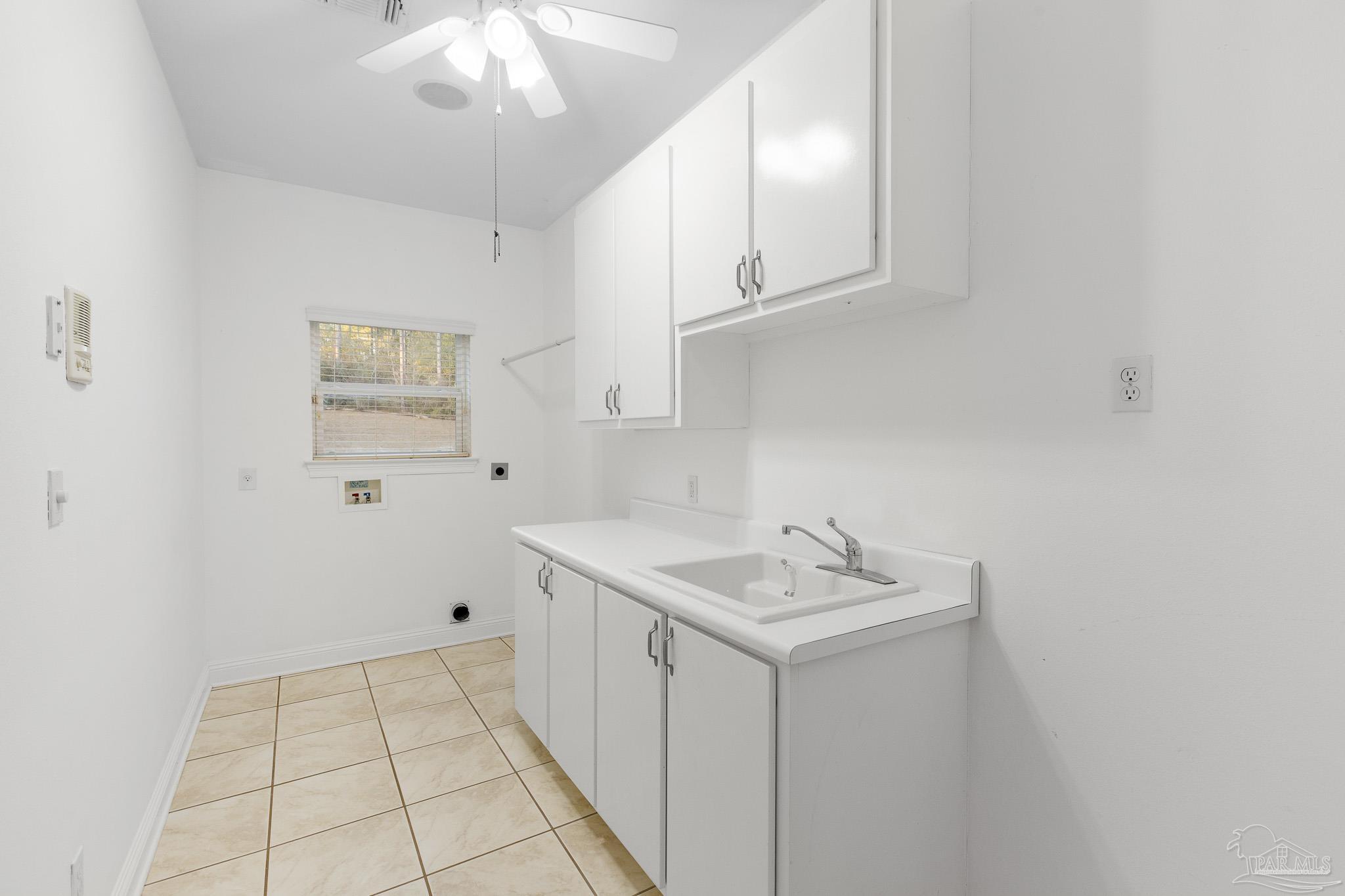 6786 Quintette Road Pace, FL 32571 - Photo 40 of 60 a bathroom with a sink a vanity and a mirror
