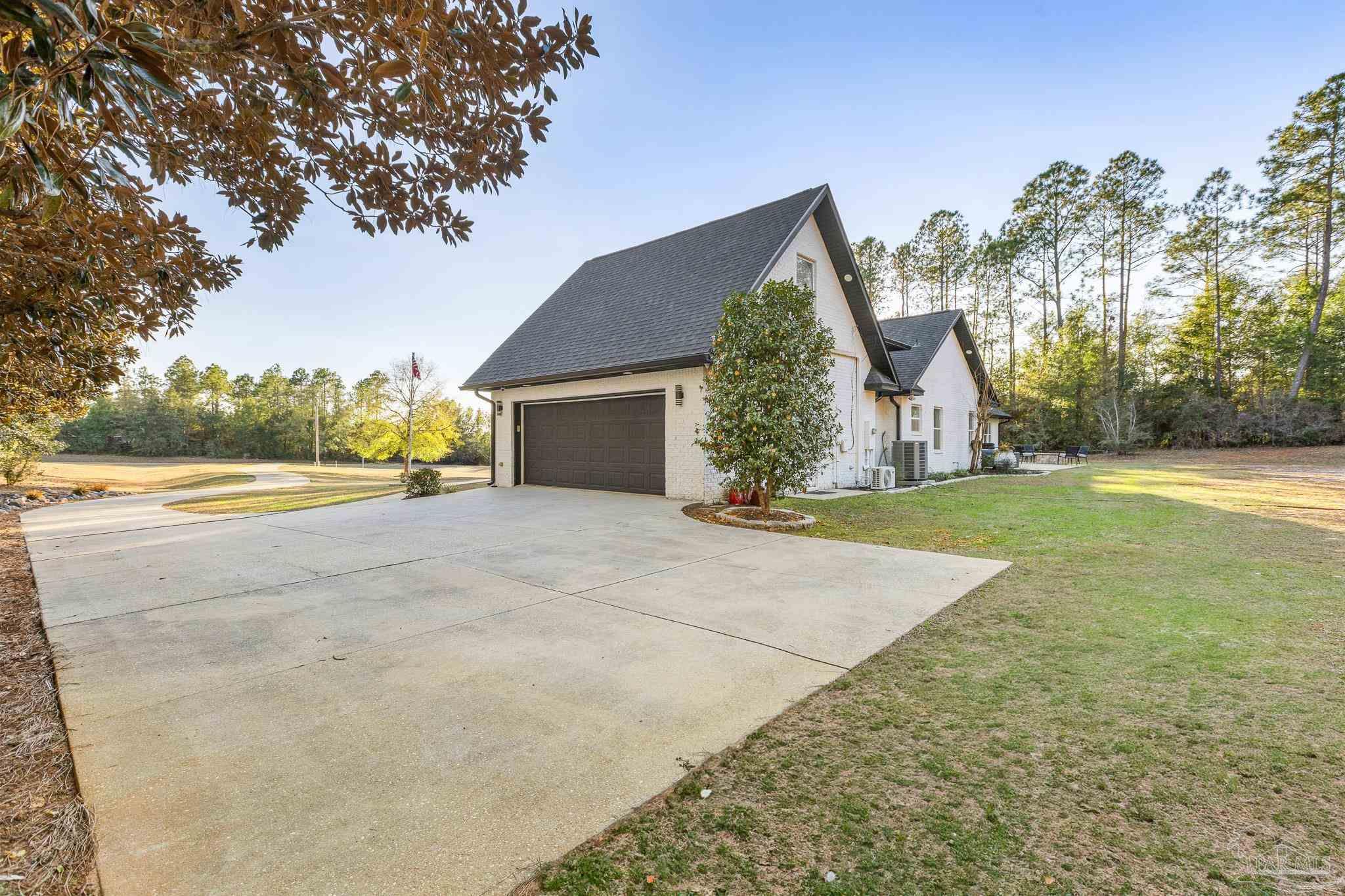 6786 Quintette Road Pace, FL 32571 - Photo 49 of 60 a view of backyard of house with green space