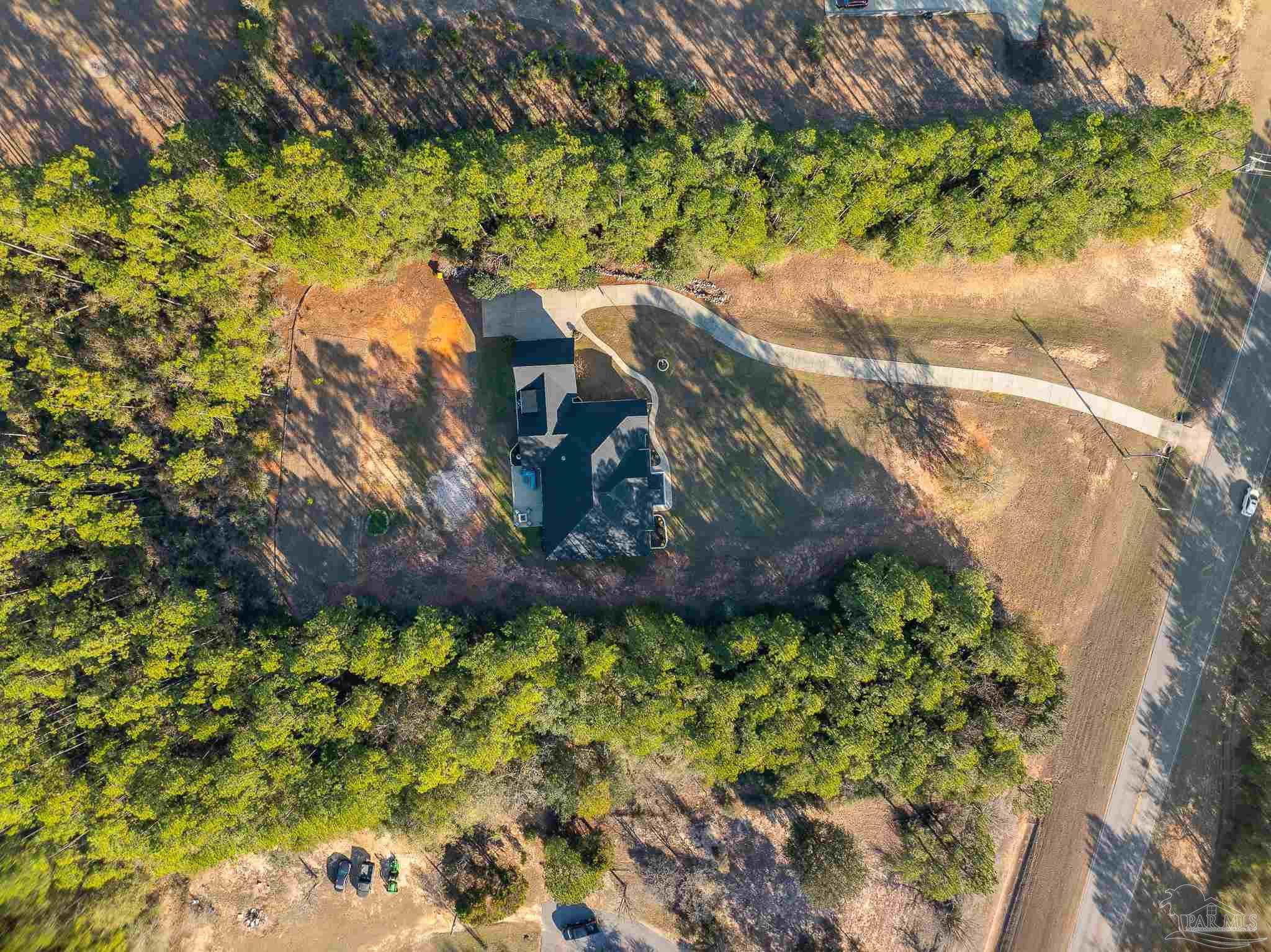 6786 Quintette Road Pace, FL 32571 - Photo 54 of 60 a view of a garden with plants