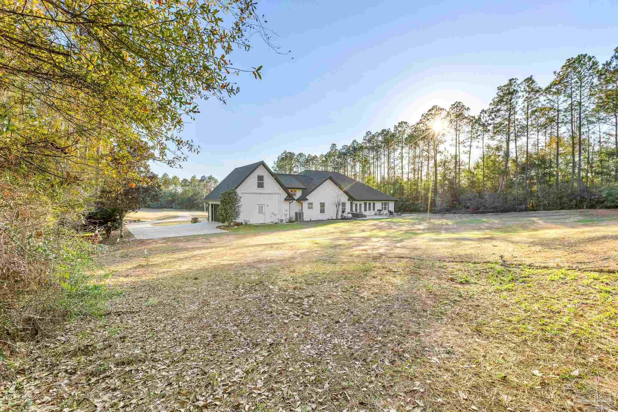 6786 Quintette Road Pace, FL 32571 - Photo 58 of 60 a view of ocean view with large trees