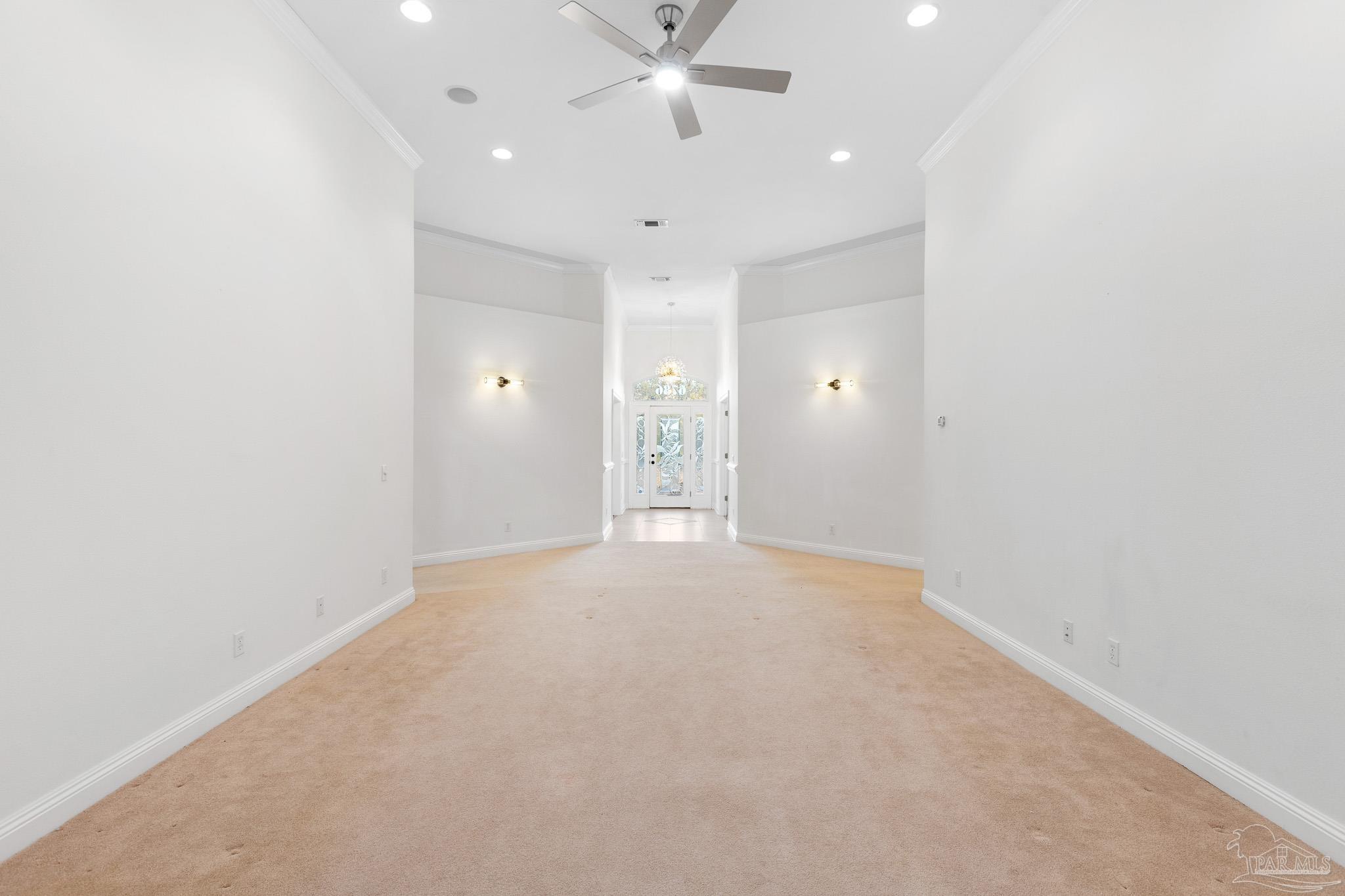 6786 Quintette Road Pace, FL 32571 - Photo 9 of 60 an empty room with a ceiling fan and window