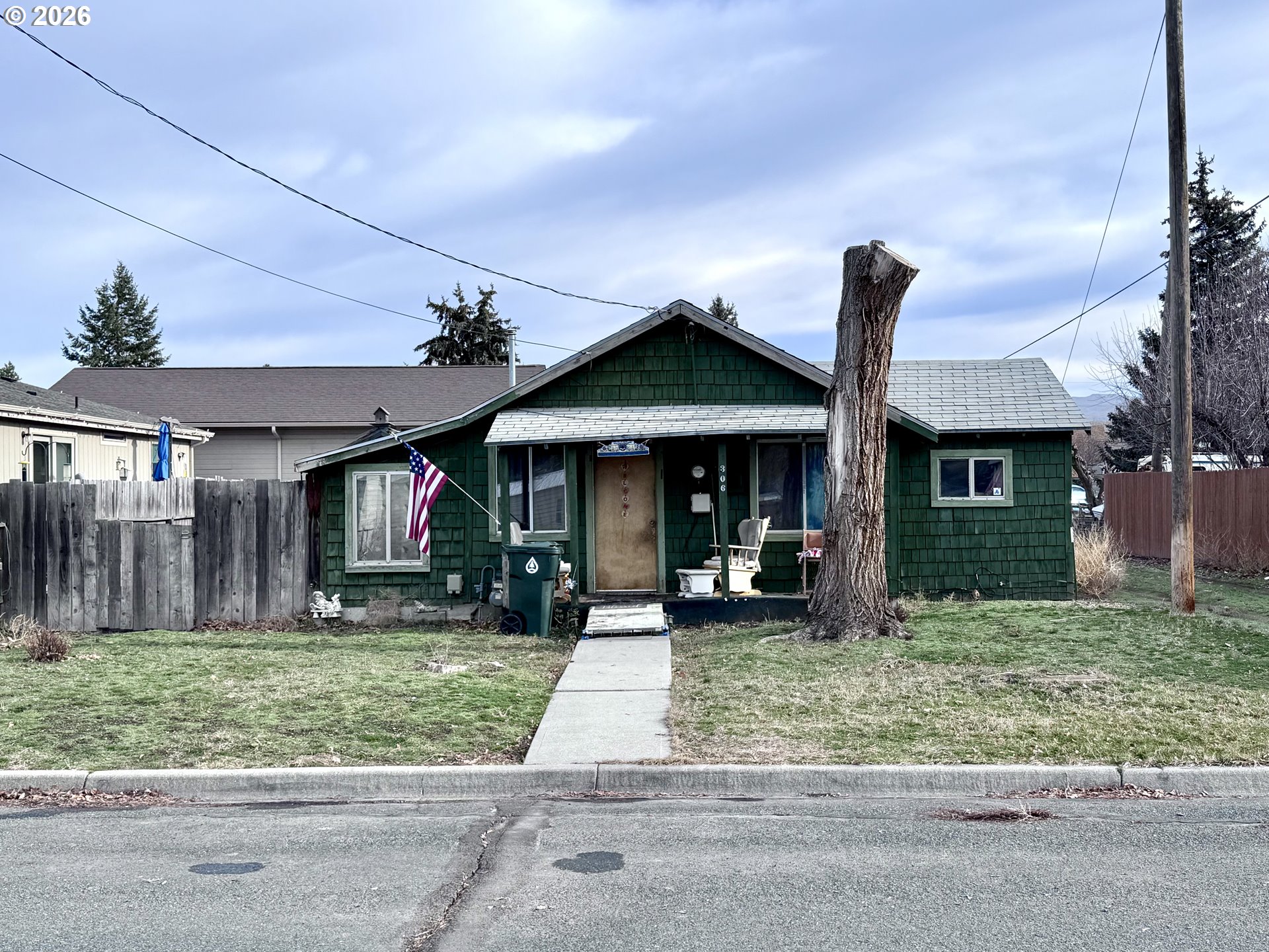 306 4th Street Baker City, OR 97814 - Photo 10 of 11 a front view of a house with a yard and potted plants